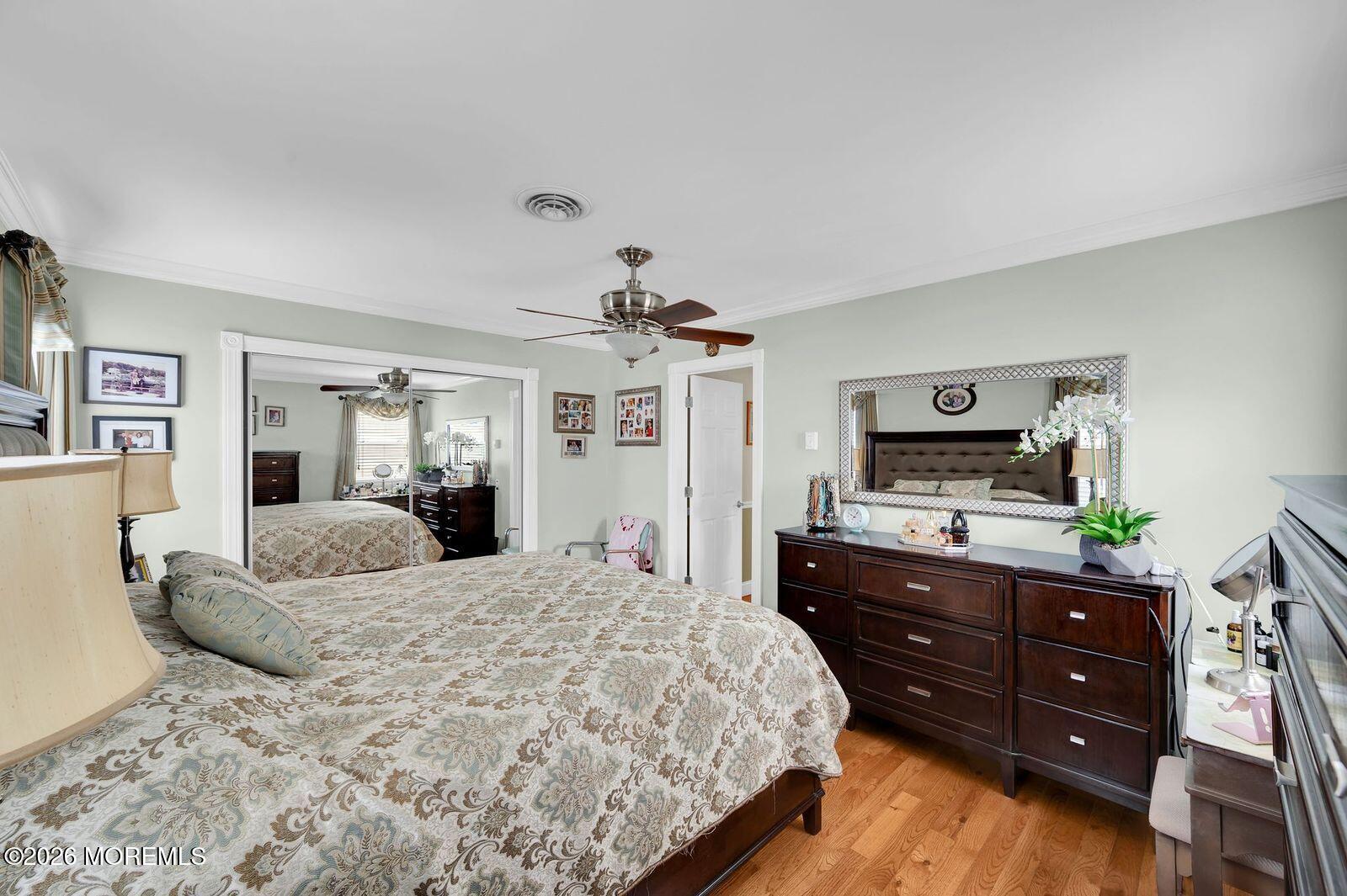 7 Eaton Lane, Unit 73 Whiting, NJ 08759 - Photo 32 of 37 a bedroom with a bed window and a dresser