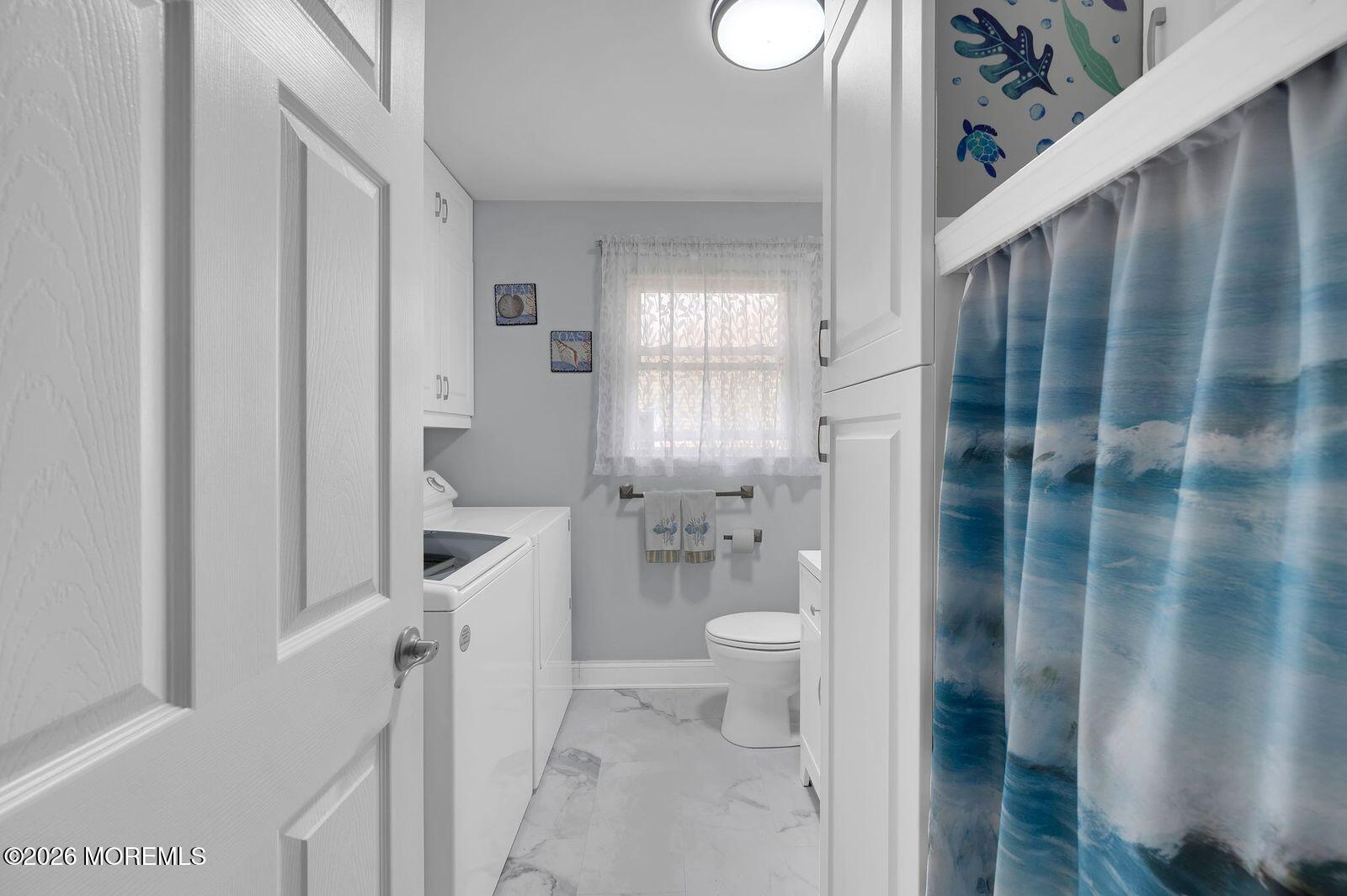 7 Eaton Lane, Unit 73 Whiting, NJ 08759 - Photo 34 of 37 a bathroom with a shower toilet and sink