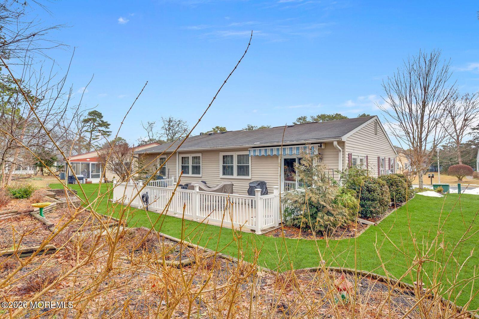 7 Eaton Lane, Unit 73 Whiting, NJ 08759 - Photo 4 of 37 a front view of a house with a yard