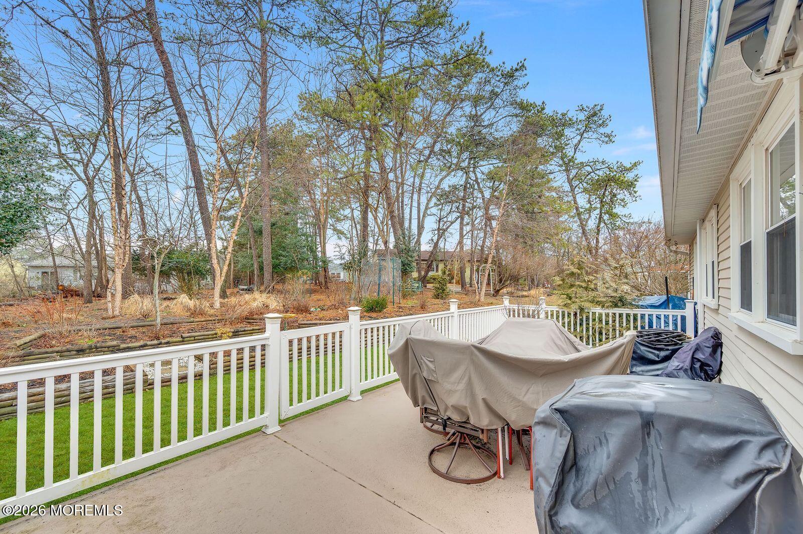 7 Eaton Lane, Unit 73 Whiting, NJ 08759 - Photo 6 of 37 a view of a patio with iron fence