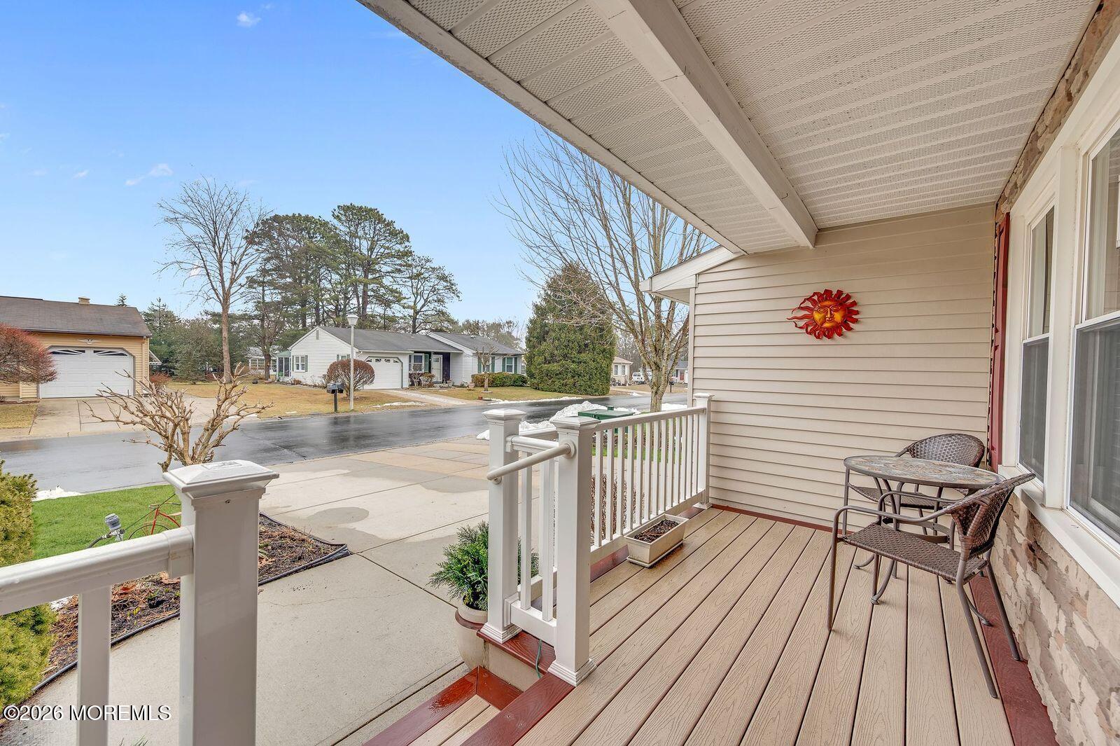7 Eaton Lane, Unit 73 Whiting, NJ 08759 - Photo 9 of 37 a view of balcony with wooden floor and seating space