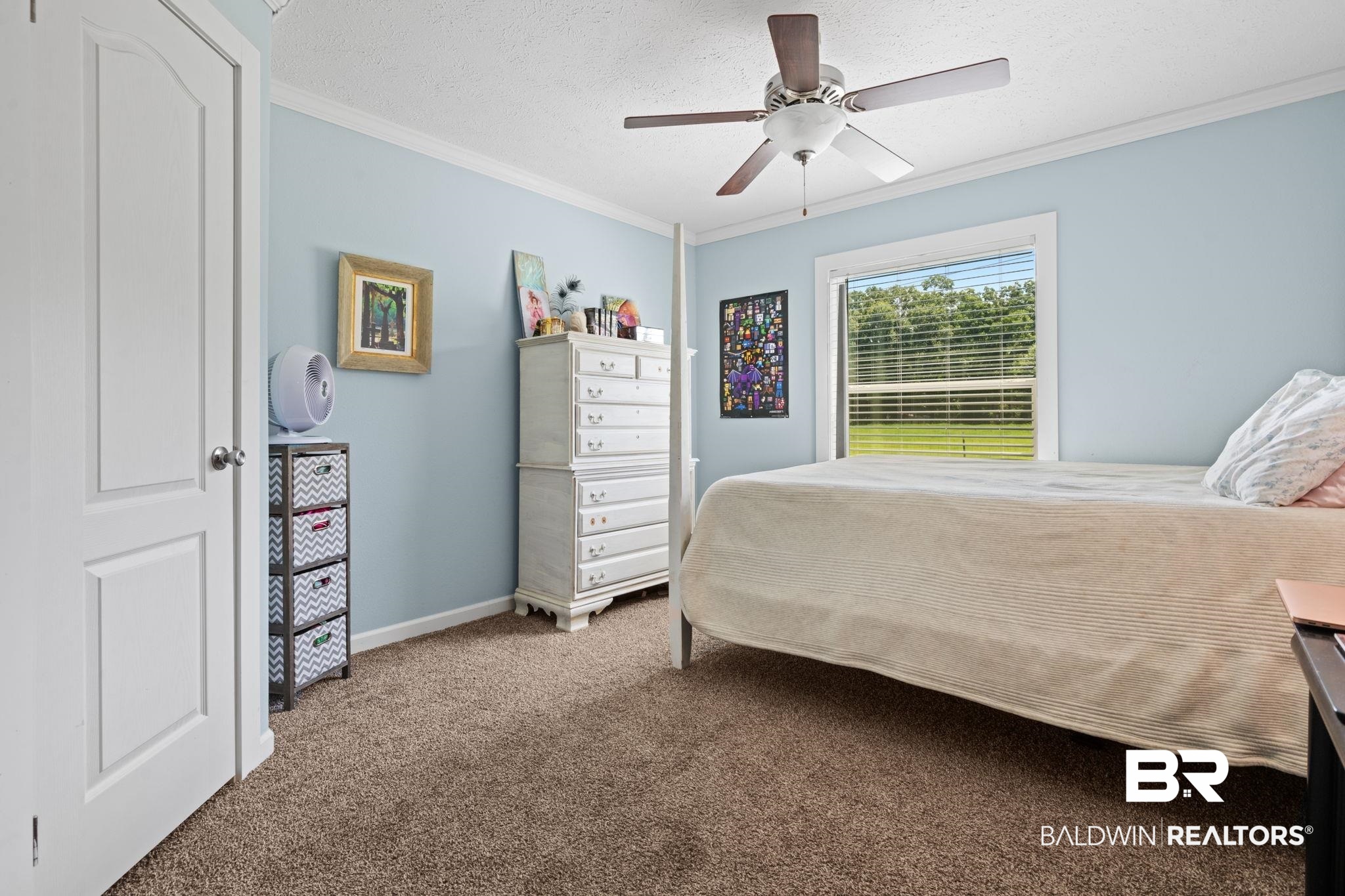10703 South Ridge Drive Semmes, AL 36575 - Photo 27 of 37 Bedroom featuring crown molding, carpet, ceiling fan, and a textured ceiling