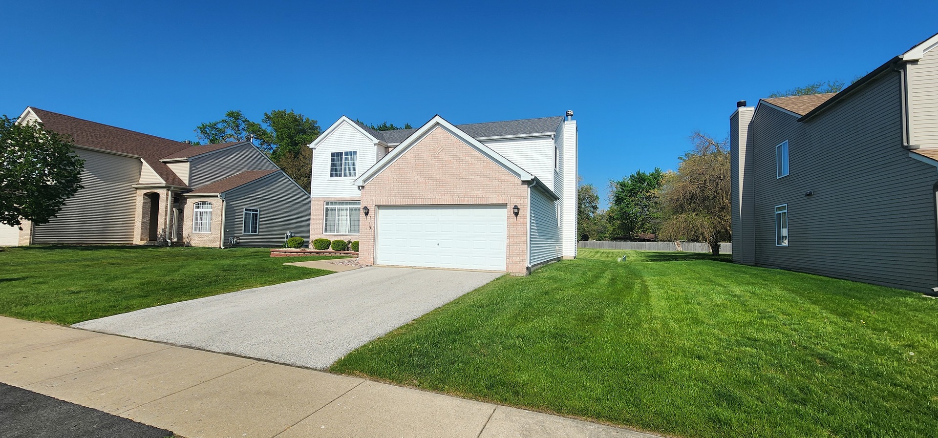 113 Sundance Road Matteson, IL 60443 - Photo 7 of 47 a view of a house with a yard and pathway