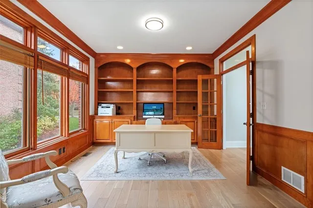 a living room with furniture a rug and a large window