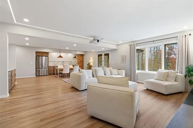 a living room with furniture and a large window
