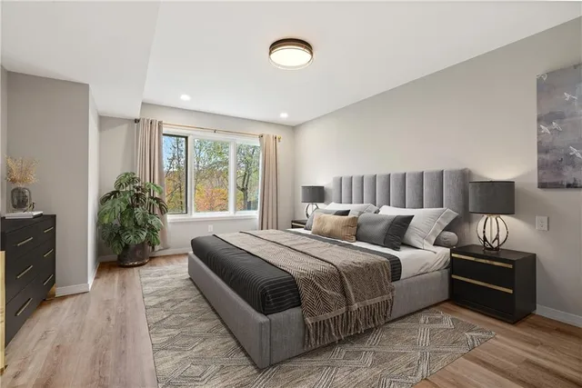 a bedroom with bed and a couch