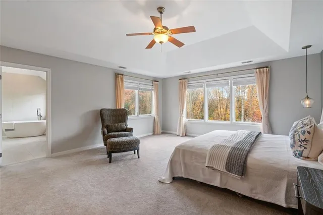 a bedroom with a bed and a couch