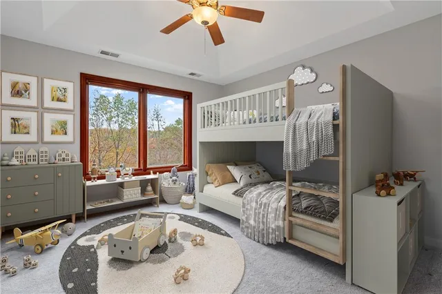 a bedroom with furniture and a large window