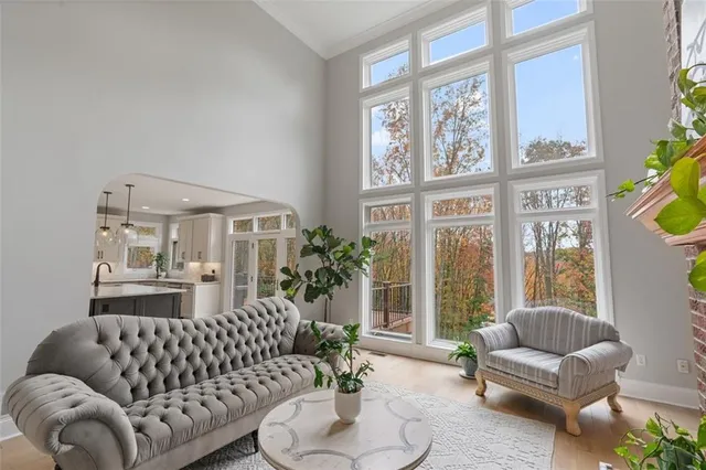 a living room with furniture and a large window