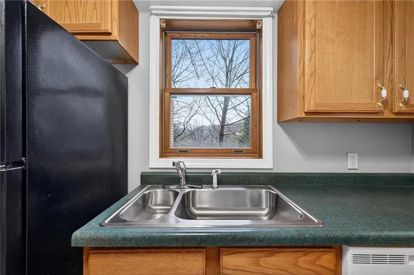 a bathroom with a sink toilet and mirror