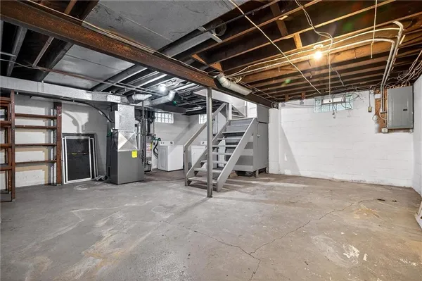 a view of an empty room with stairs