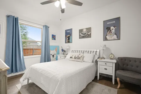 a bedroom with a large bed and a couch