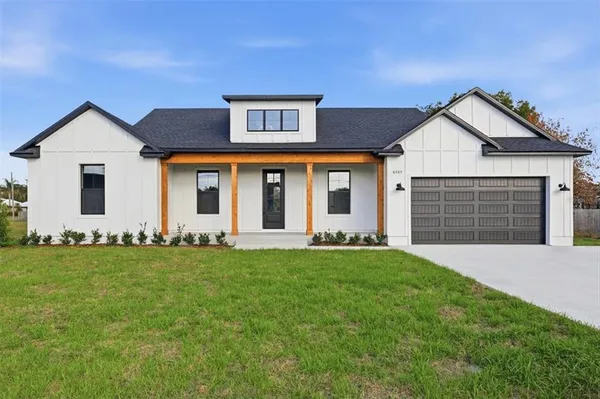 front view of a house with a yard