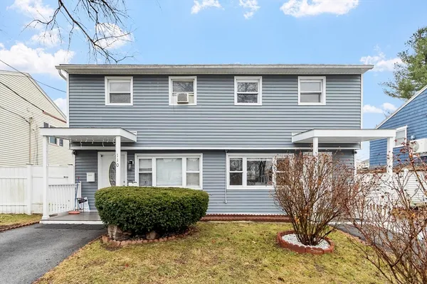a view of a house with a yard