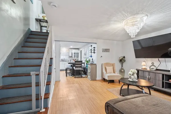 a view of a livingroom with furniture and a flat screen tv