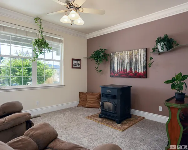 a view of a workspace with furniture and wooden floor