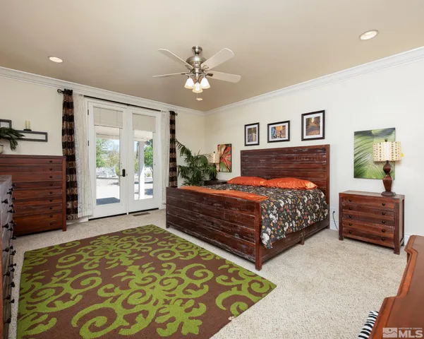 a bedroom with a bed and dresser