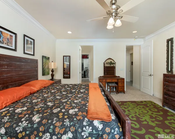 a spacious bathroom with a tub sink and mirror