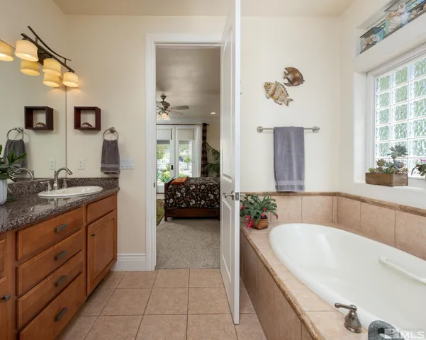 a bath tub sitting next to a window