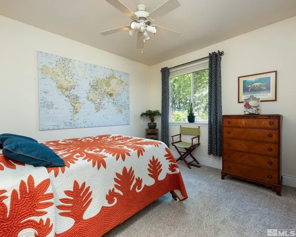 a bathroom with a double vanity sink and a window