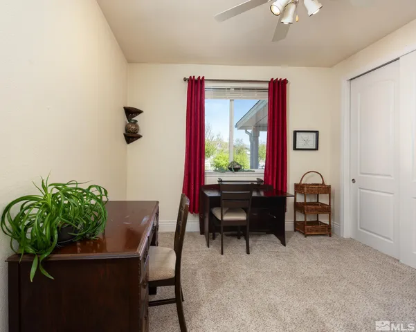 a living room with furniture and white walls