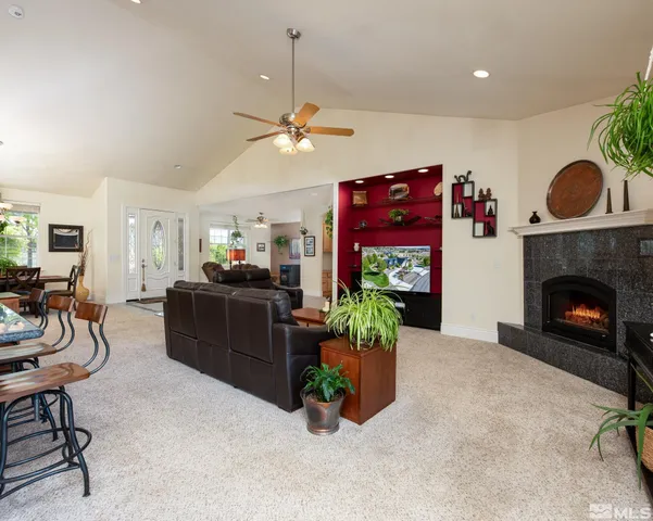 a kitchen with a sink cabinets and wooden floor
