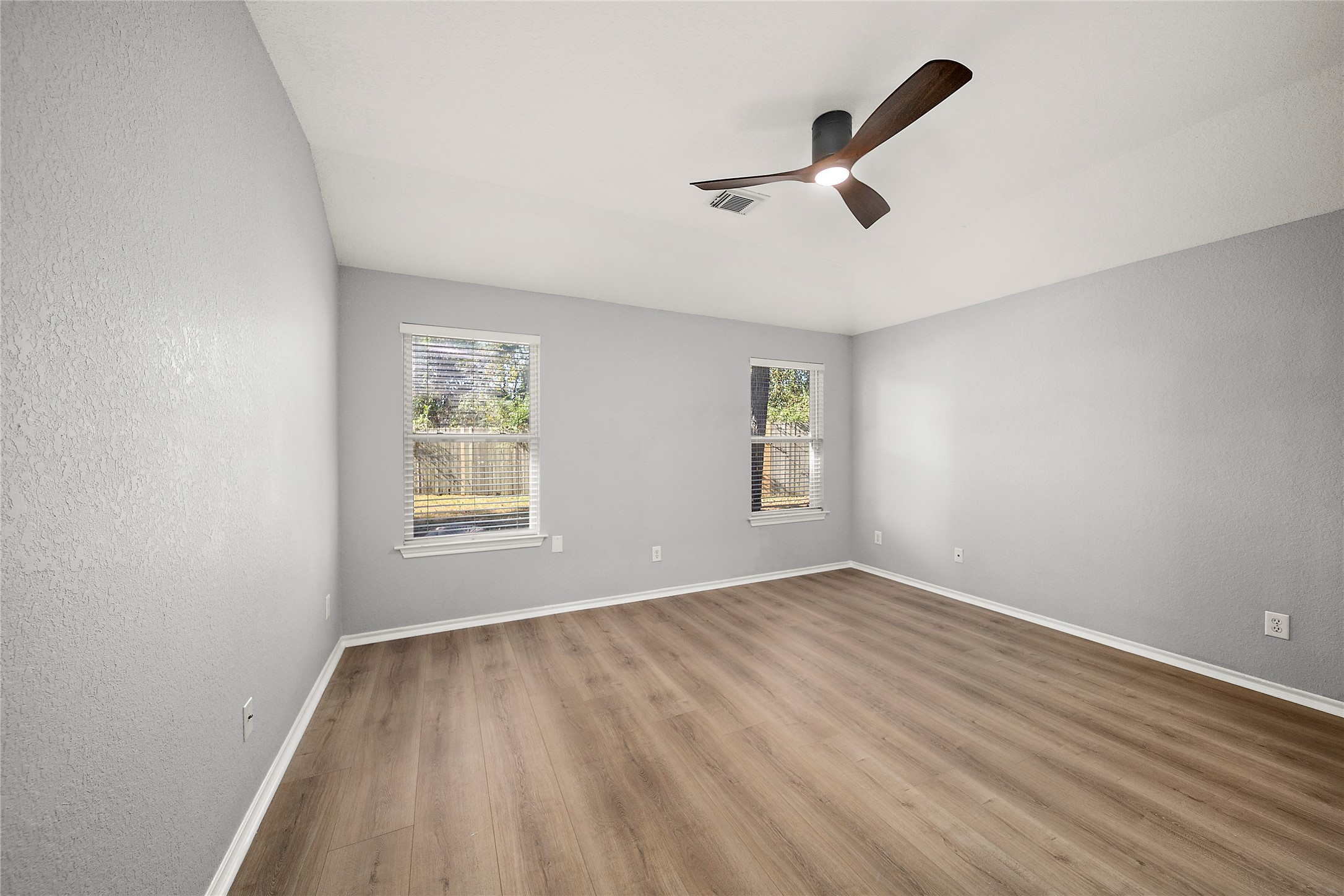 62 Rookwood Court The Woodlands, TX 77382 - Photo 12 of 24 a view of empty room with wooden floor and fan