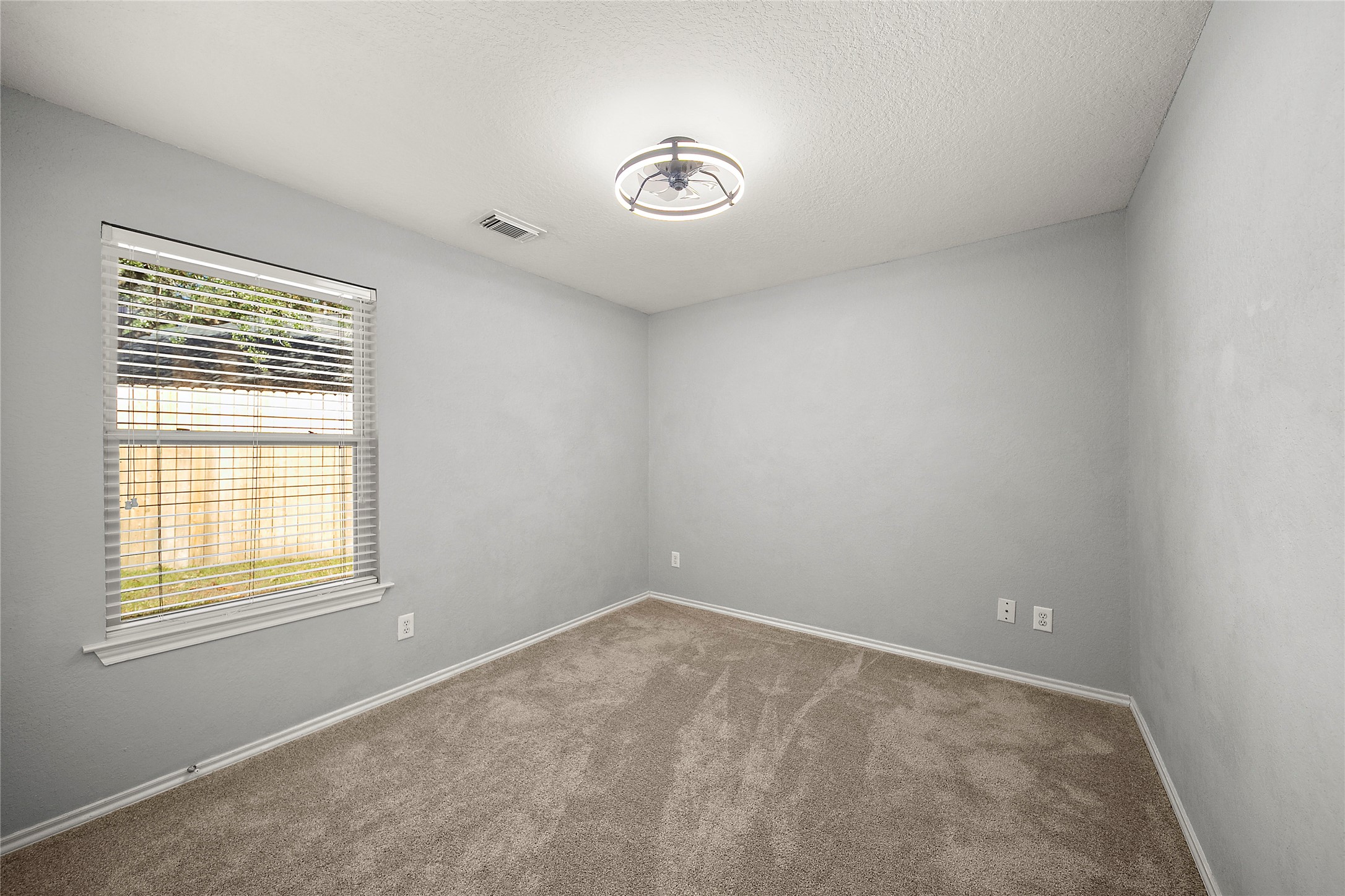62 Rookwood Court The Woodlands, TX 77382 - Photo 17 of 24 an empty room with a window