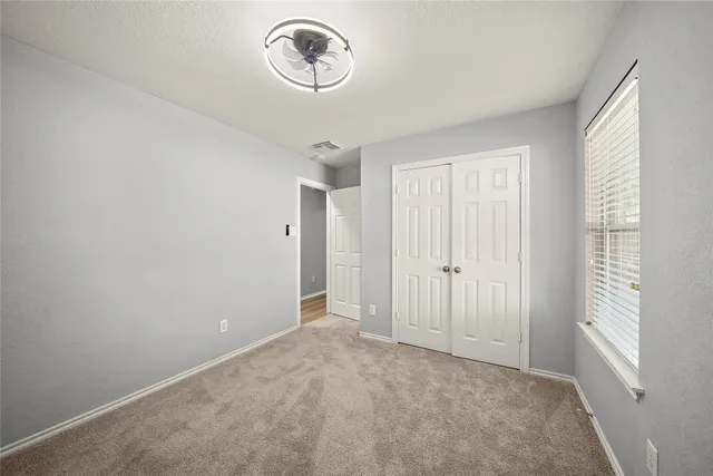 a view of a room with a fan