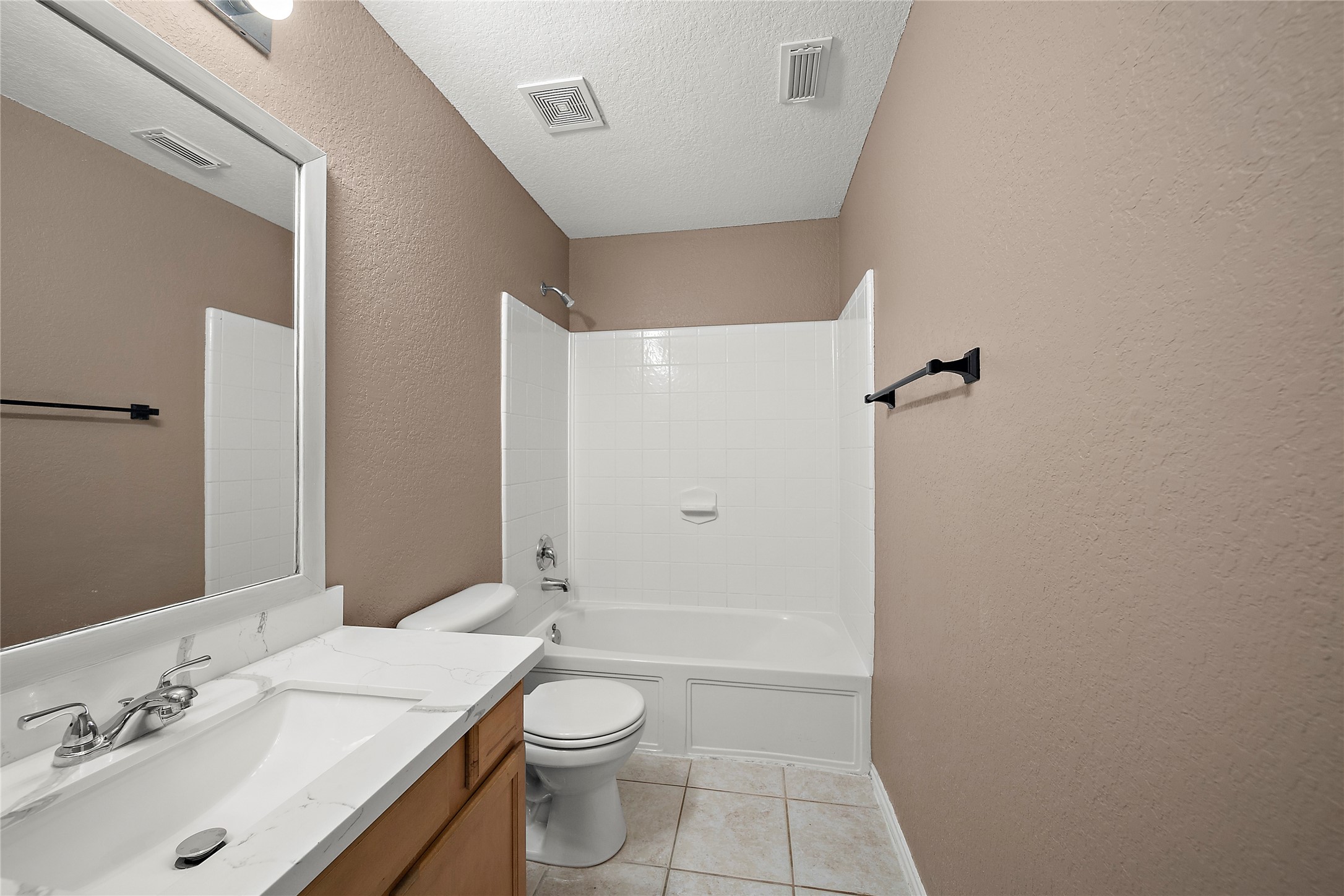 62 Rookwood Court The Woodlands, TX 77382 - Photo 21 of 24 a bathroom with a sink a toilet and shower