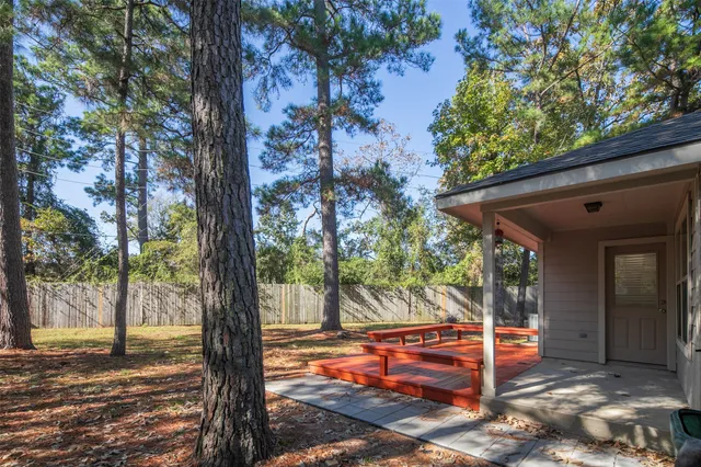a view of a house with a tree