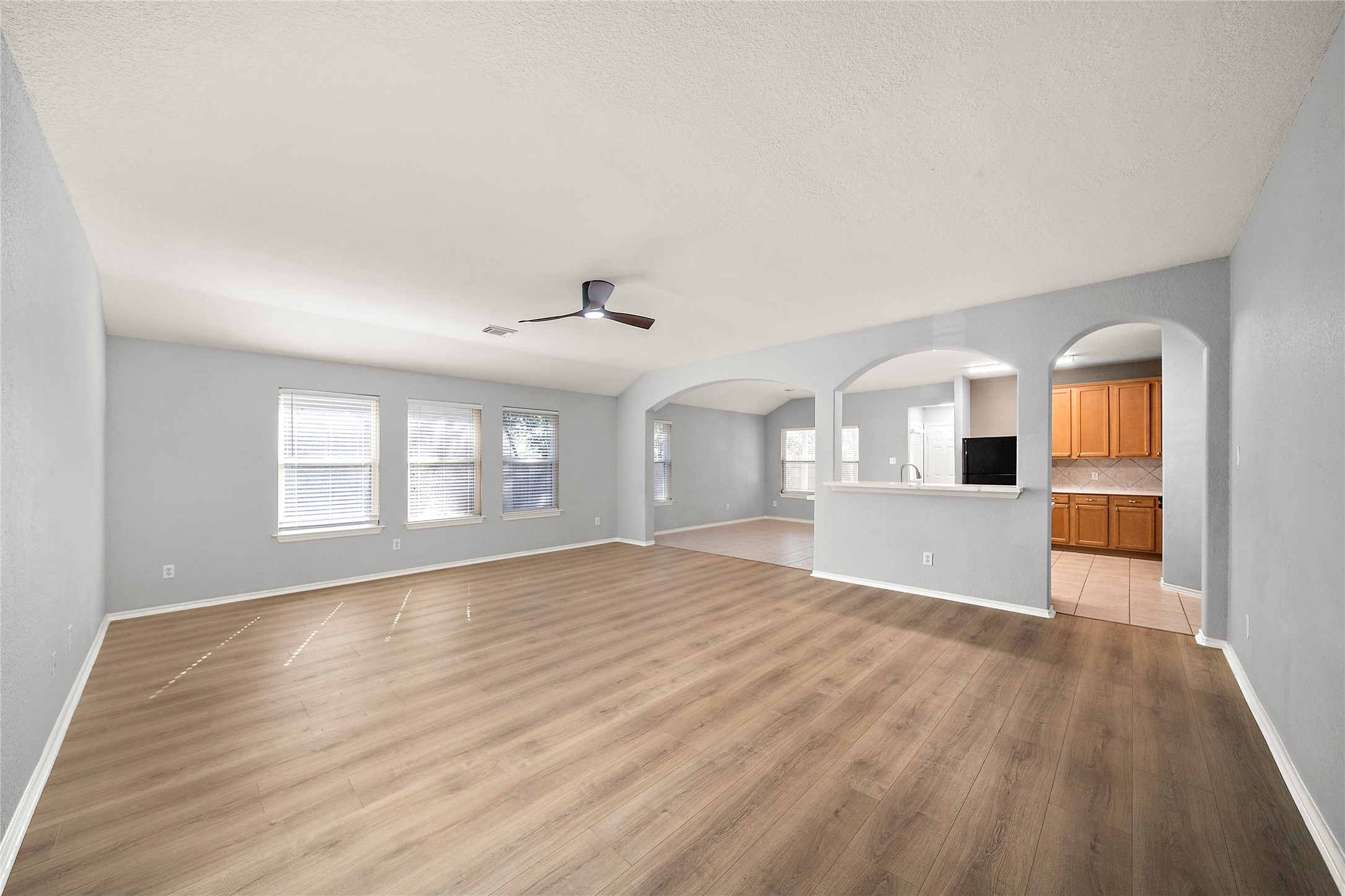 62 Rookwood Court The Woodlands, TX 77382 - Photo 6 of 24 a view of empty room with wooden floor and fan