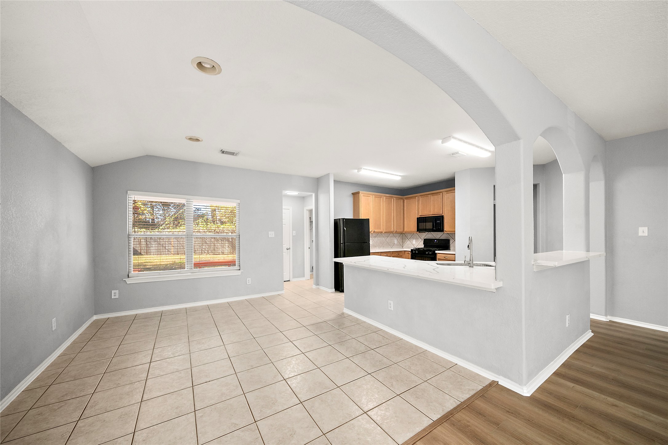 62 Rookwood Court The Woodlands, TX 77382 - Photo 10 of 24 a view of kitchen with kitchen island microwave and view living room