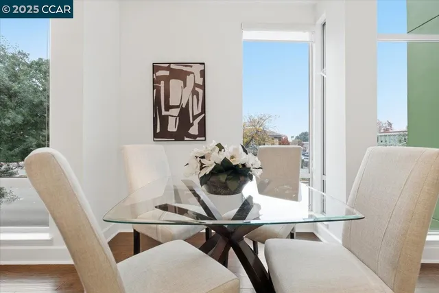 a view of a patio with table and chairs