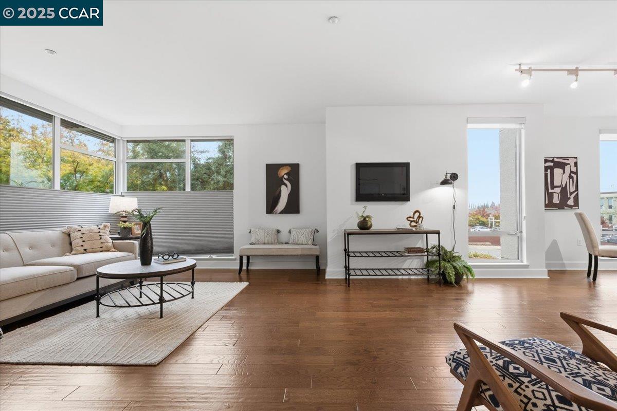 555 Ygnacio Valley Road, Unit 204 Walnut Creek, CA 94596 - Photo 18 of 38 a living room with furniture and a flat screen tv