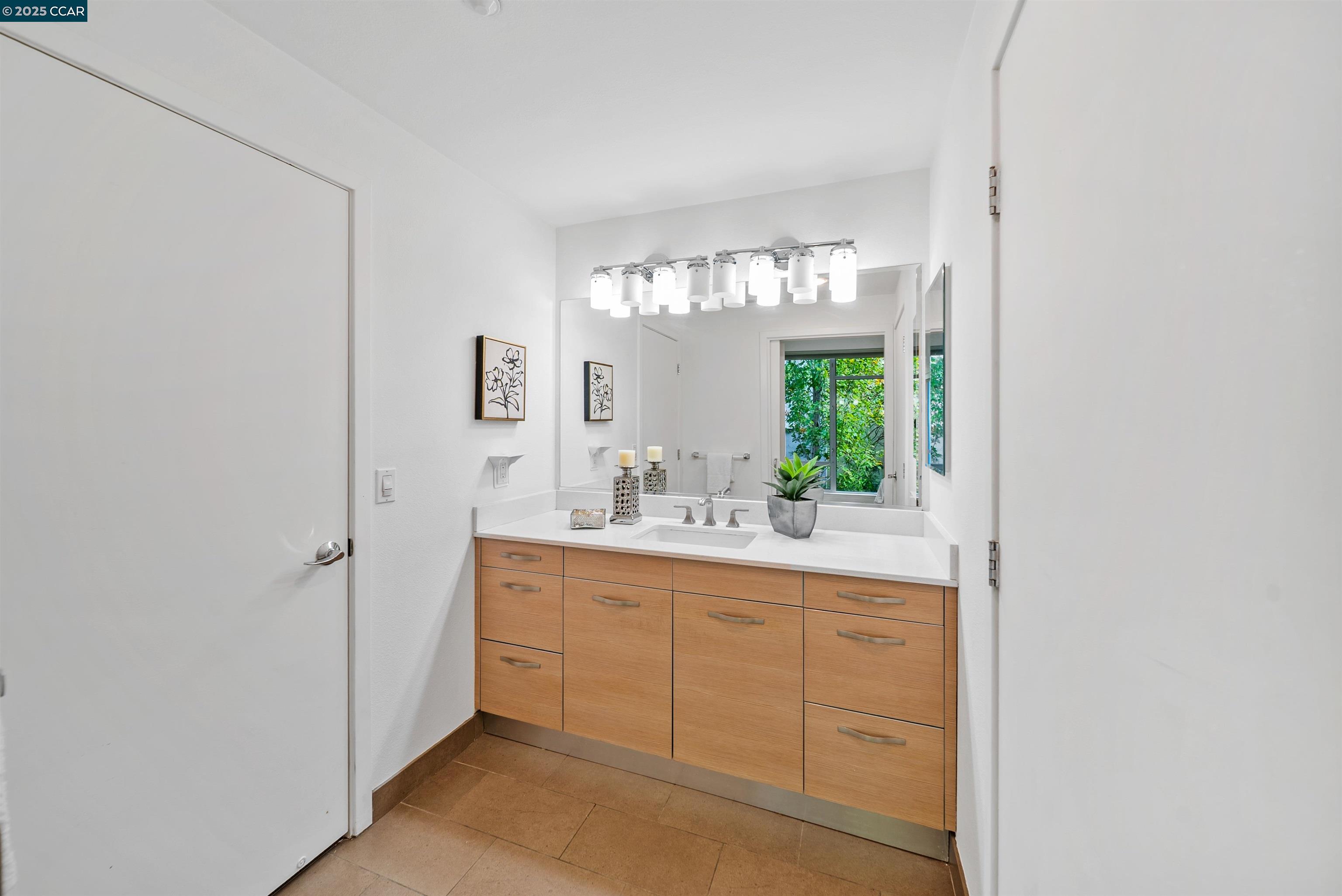 555 Ygnacio Valley Road, Unit 204 Walnut Creek, CA 94596 - Photo 22 of 38 a bathroom with a sink and a mirror