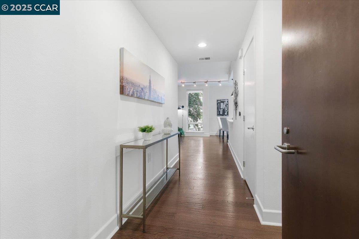 555 Ygnacio Valley Road, Unit 204 Walnut Creek, CA 94596 - Photo 3 of 38 a view of a hallway with wooden floor