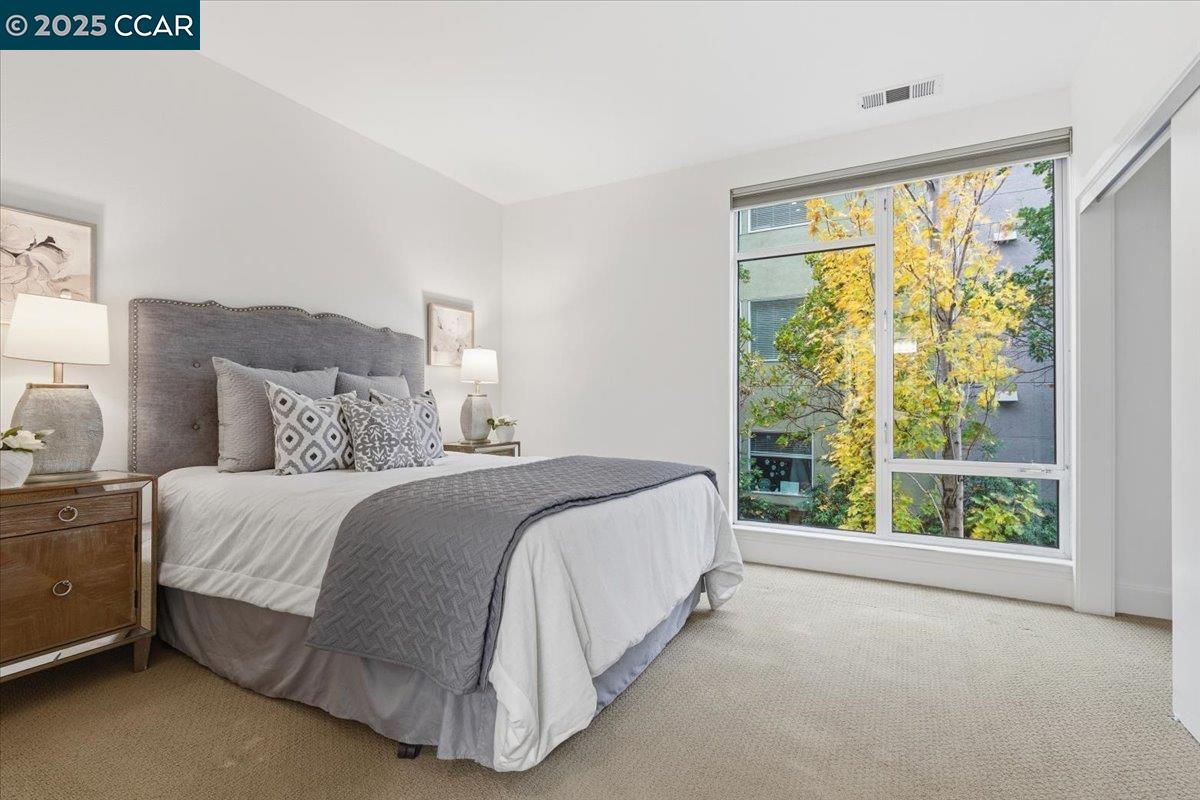 555 Ygnacio Valley Road, Unit 204 Walnut Creek, CA 94596 - Photo 35 of 38 a bed sitting in a bedroom next to a window