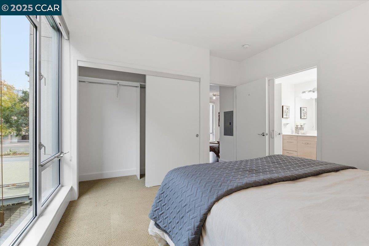 555 Ygnacio Valley Road, Unit 204 Walnut Creek, CA 94596 - Photo 36 of 38 a bedroom with a bed and a large window
