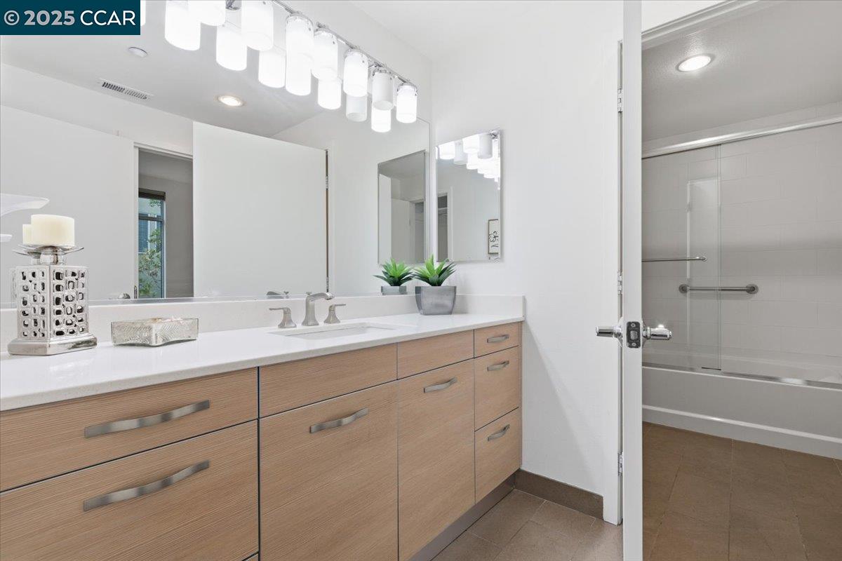 555 Ygnacio Valley Road, Unit 204 Walnut Creek, CA 94596 - Photo 38 of 38 a bathroom with a double vanity sink mirror and shower