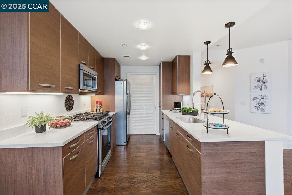 555 Ygnacio Valley Road, Unit 204 Walnut Creek, CA 94596 - Photo 7 of 38 a kitchen with stainless steel appliances granite countertop a sink stove and refrigerator
