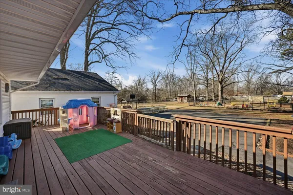 a view of a roof deck with wooden floor