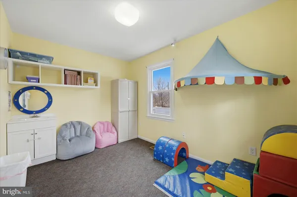 a bedroom with furniture and a wooden floor