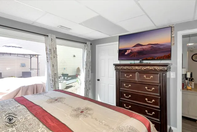 a bed room with a bed and a television