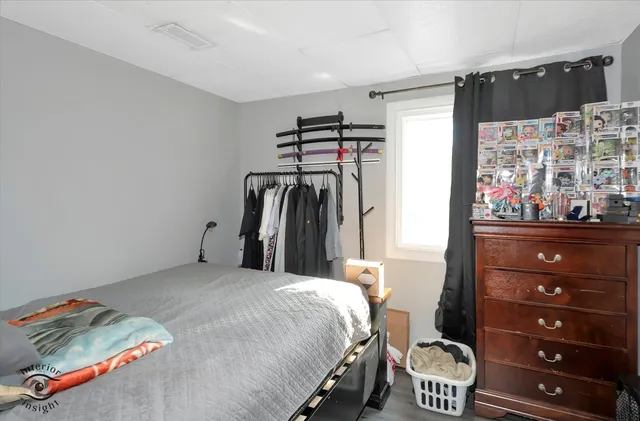 a bedroom with a bed and a cabinets