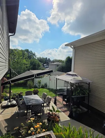 a view of house with outdoor seating space