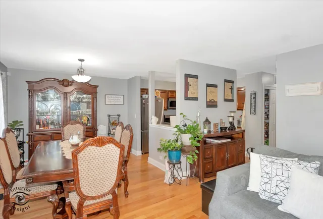 a view of a dining room with furniture window and wooden floor