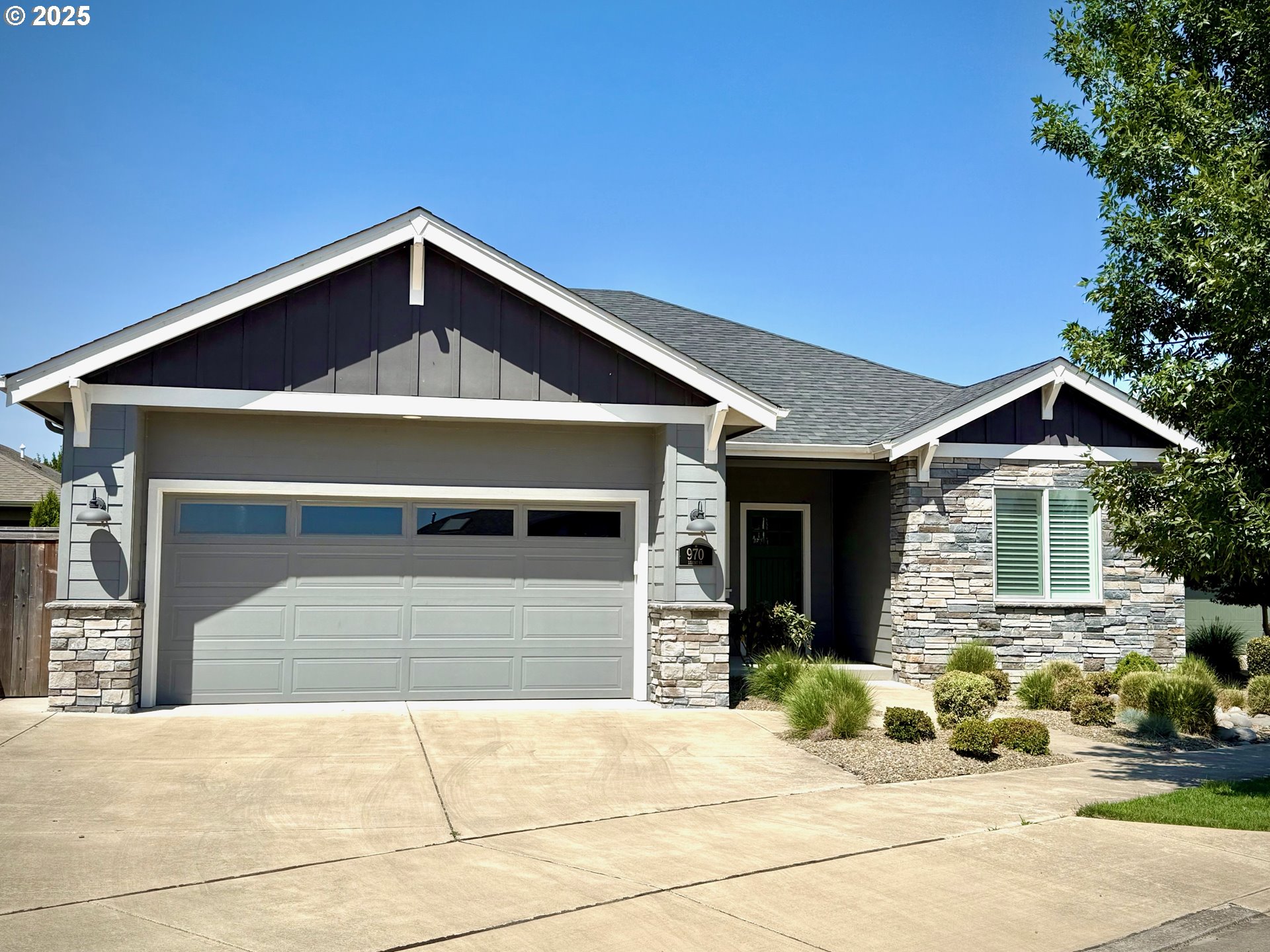 a front view of a house with a garage
