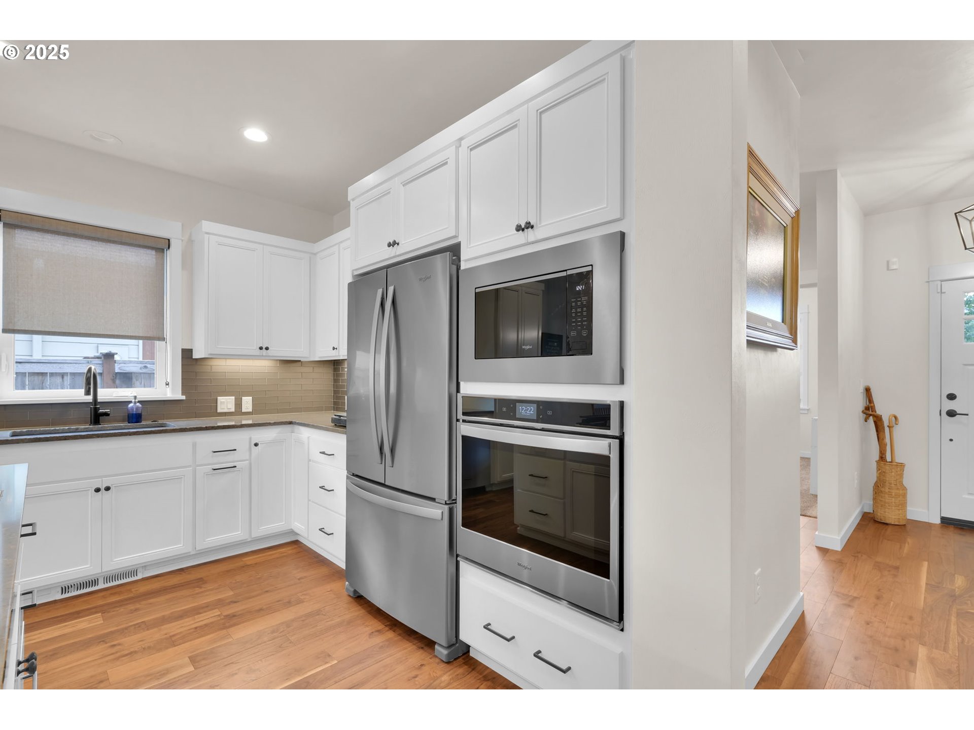 970 Lupine Street Springfield, OR 97477 - Photo 20 of 47 a kitchen with stainless steel appliances granite countertop a stove a microwave and a sink