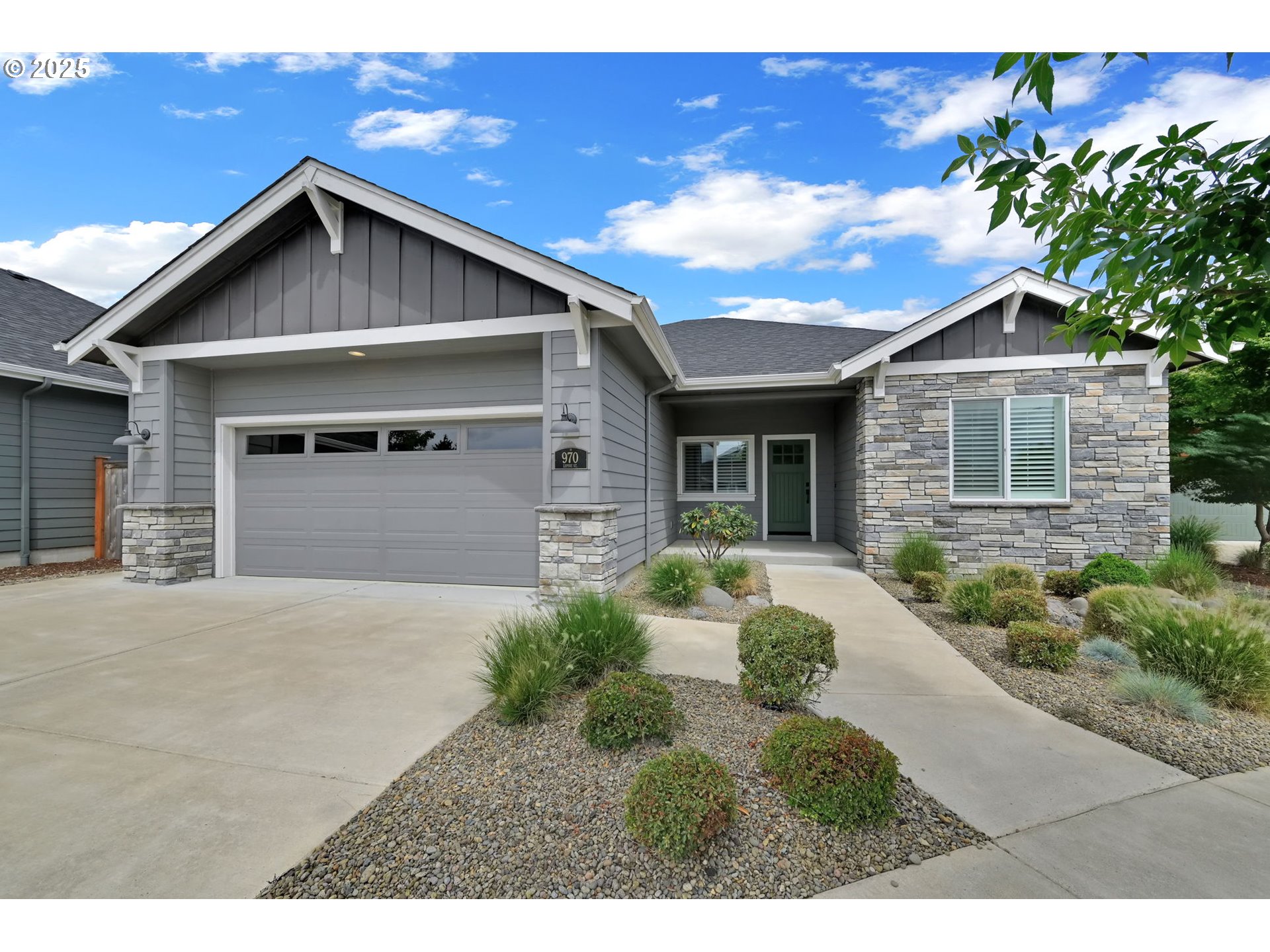 970 Lupine Street Springfield, OR 97477 - Photo 2 of 47 a front view of a house with a yard